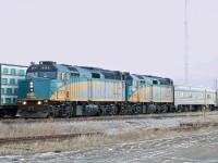 In the late afternoon light of a winterey Alberta day VIA #1 running about 10 hours late slowly rolls by a meet at Tofield.