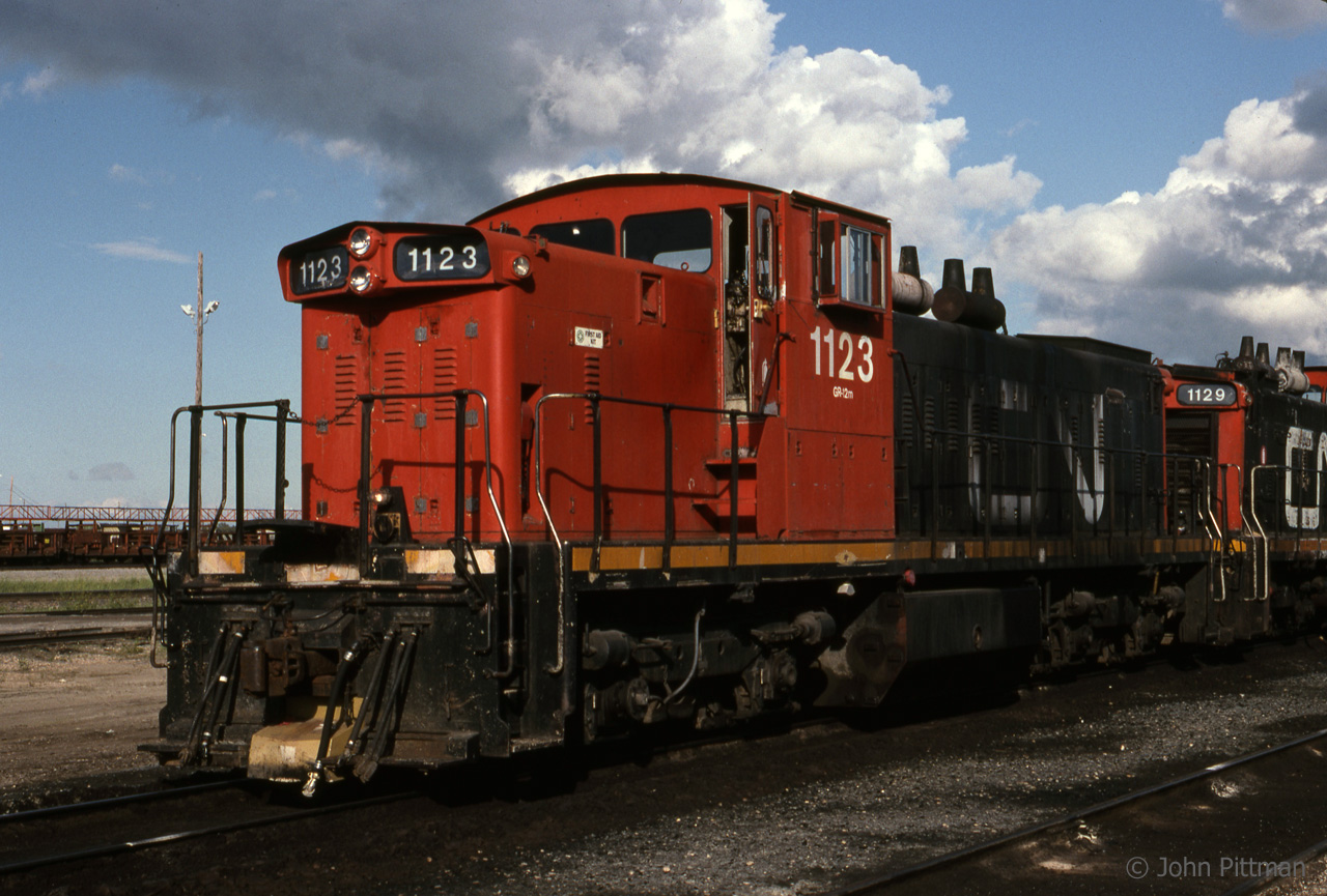 GMD-1 CN 1123 is outside Symington Yard Diesel shop with sister 1129. Visiting Winnipeg in June 1997, I was hoping to see GMD-1 locomotives, B-B and A1A-A1A, and was not disappointed.  Not knowing that some years later, a few would turn up in my area and work yards along the Oakville Subdivision west of Toronto - they were 1400 series rebuilds not in this colour scheme.