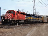 CP 6021, DME 6091 and ICE 6450 lead this westbound set of autoracks elephant style as they pass Dougall Ave. during the spring of 2011. After a quick crew change at Wellington Ave. the train would head through the tunnel before continuing on to Chicago.