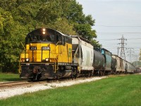  Essex Terminal GP9 #108 leads a hefty freight out to Ojibway Yard after picking up cars from CN and CP during the early fall of 2010. This area has been forever changed as The Rt. Hon. Herb Gray Parkway has been built through here, the area at right to the road is now occupied by a berm planted with Pin Oaks, Swamp White Oaks and Silver Maples.
 An overpass will be built here next year and work on the new Gordie Howe International Bridge should commence next fall as the Tender for the bridge - estimated at anywhere from $2.1 billion to $4.8 billion to build - will be awarded to the winning bidder next spring. A time machine shot may be needed for when the overpass is built :)