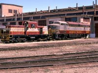 Merry Christmas to everyone on Railpictures.ca.
In late July 1974 I flew into Calgary for an overnight stay. After renting a car and driving to the CP yard where I received permission to take photos, I headed to the diesel shop. CP 10 (CLC DT-2) was moving CP 4057 (CLC CPA16-4). Within the space of about two minutes, a door opened up and 4057 was put inside. I was blessed to take this photo, and it is one of my favorites.
