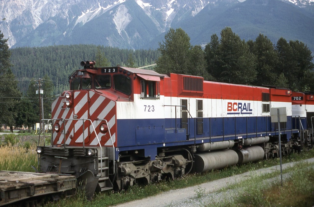 BC Rail M630W 723 and C630 702 sit in the back track at Pemberton ? with a work train. Photo taken from the south bound Budd cars from Prince George.