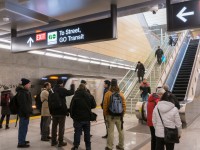 Thousands gathered for the opportunity to visit each of the six new subway stations on Line 1 as part of the Toronto-York Spadina Subway Extension. Here at Downsview Park Station, a southbound train bound for Toronto Union Station and eventually Finch enters on the southbound track, amidst a group of curious onlookers. In two weeks, the significance of this station will increase as GO trains on the Barrie Line will begin to stop here, two storeys above. Commuter train passengers will have the option to transfer to the subway for trips to areas other than the immediate downtown core around Union Station and subway passengers will be able to transfer to the train for a faster trip if their destination is near Union Station. That transfer synergy combined with development potential in its low density surroundings are sure to make this a well patronized station in the future.