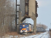 Setting off one final tank car for storage and allowing the previously cloudy skies to open up, the pair of F units momentarily pause under the old coaling tower