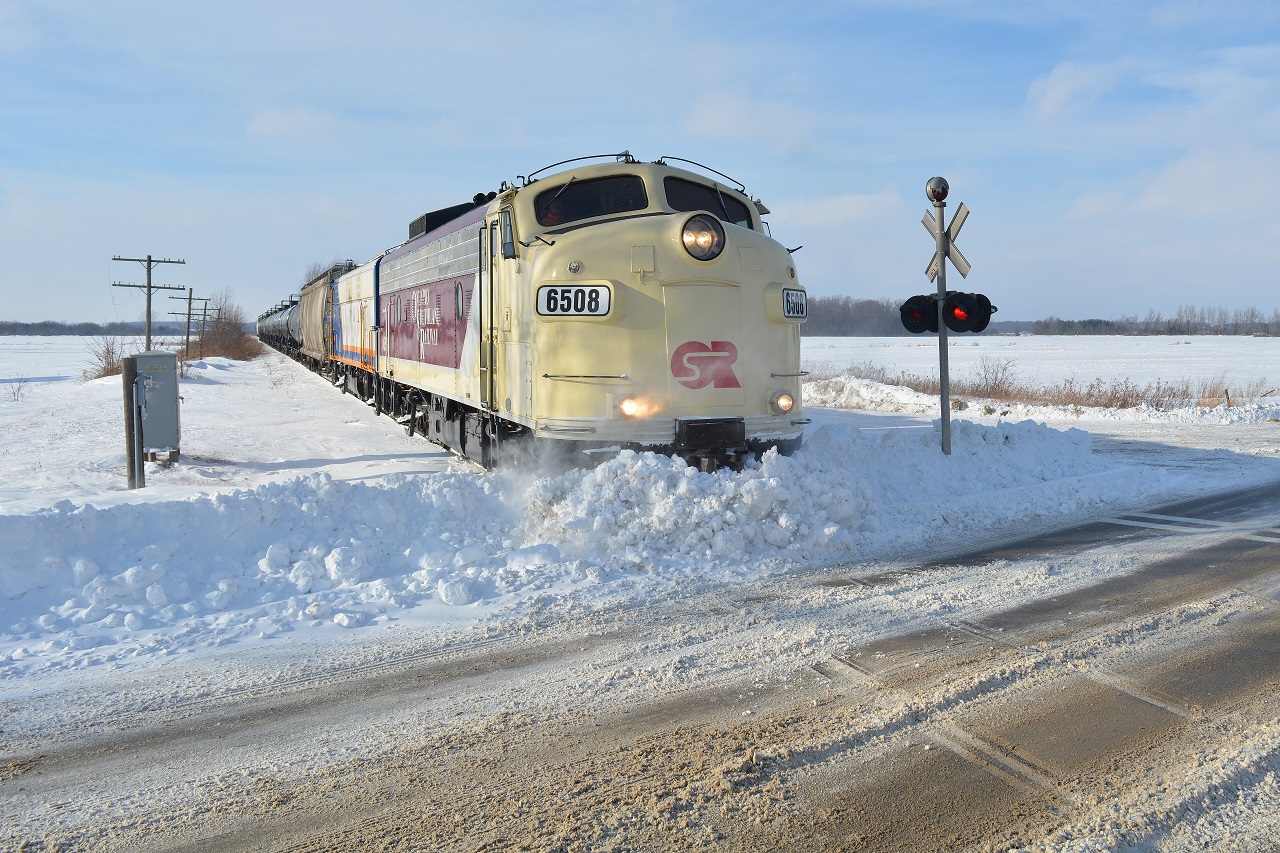 The St. Thomas Job clears the track block at Belmont Rd. from the week's snow build up at a speedy less than 10mph