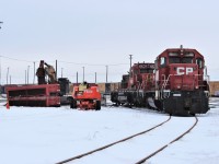 CP 6618 and 6623 are getting some torch work done to salvage usable parts while their long hoods now removed sit piled to the left.