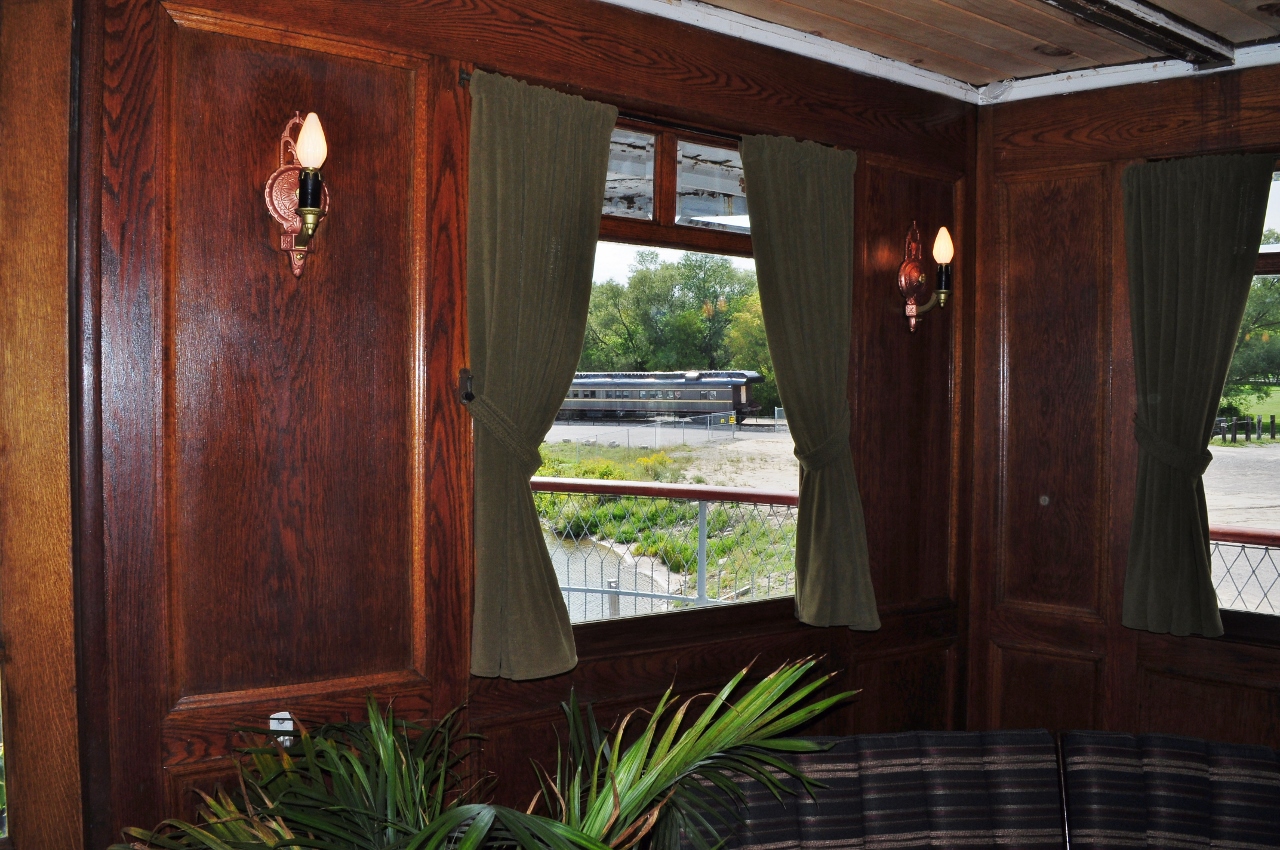 ...two Edwardian* Era ex C.P.R. passenger assets meet again....


 ex C.P.R. 12-1 sleeper Hungerford ( 07 / 1913) as viewed from the ( 'original' ) boat tail lounge of the ex C.P.R.  S.S. Keewatin ( 07 / 1906).


 September 6, 2013 digital by S.Danko on board the S.S. Keewatin at the Port McNicoll dock

 
 What's Interesting


 coupled to ex C.P.R. Hungerford is ex C.P.R. Coach 1431


 ex Ossawippi Express Dining Car / ex CP Safety Instruction Car 41 / ex C.P.R. Coach 1431 ( built December 1923)  


 ex Ossawippi Express Dining Car / ex Leaside Station Restaurant dining room / ex C.P.R. Vision test car 65 - ex C.P.R. 12-1 sleeper Hungerford (built July 1913),


....prior to the 1955 introduction of the C.P.R. 'The Canadian' and the 1960 completion of the northern Ontario section of the  Trans Canada Highway (Agawa River to Marathon ) , I am informed that the classy way to travel to the Canadian West was NOT by train, the C.P.R. 'Dominion' being somewhat lacking in fine amenities and with the slow schedule ...  the S.S. Keewatin and sister ship S.S. Assiniboia both built 1907 by Fairfield Shipbuilding and Engineering Company in Scotland  fulfilled that need ….. then the 2012 return of the ex C.P.R. S.S. Keewatin to Port McNicoll ….. Refer the web for history.


 * The Edwardian period is portrayed as a romantic golden age of long summer afternoons and garden parties, basking in a sun that never sets on the British Empire. This perception was created in the 1920s and later by those who remembered the Edwardian age with nostalgia, looking back to their childhoods after the horrors of the World Wars. (credit: Wikipedia)

  
 Port McNicoll harbour update: since my 2013 visit the re-development of the Port McNicoll harbour lands stalled, a 2017 sale of the harbour lands property (excluding the S.S. Keewatin) to another development company may re-start re-development plans, as far as I know the rail cars remain on site. 


Trivia: if you had dined at the Leaside Station Restaurant ( circa 1975 to 1983 operated by CP Hotels ), it is likely that you were in the  Hungerford ( appropriately named ) passenger car.


sdfourty