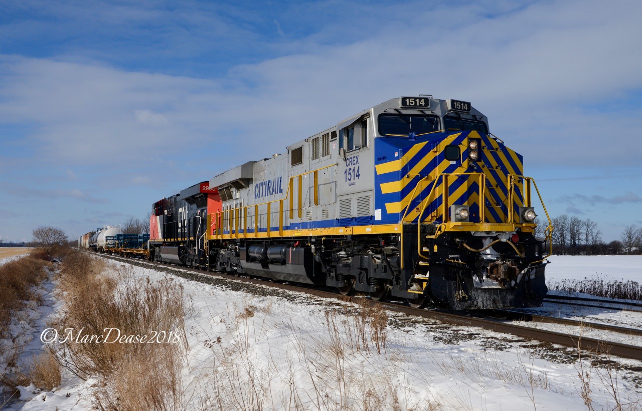 The daily 509 train from London-Sarnia-London ended the year yesterday with a double CREX lashup and some poorly timed cloud cover. Today a new year begins with a little more sunshine and the east bound leader is CREX 1514 on a slow roll at Waterworks Sideroad.