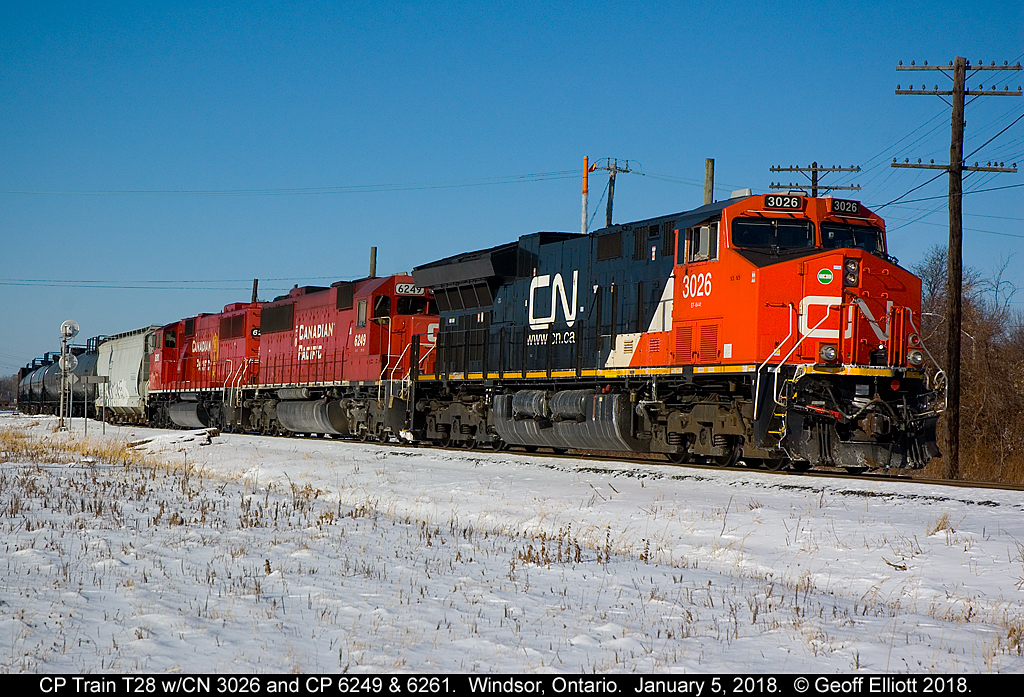 CP Train T28 has returned from the U.S. into Canada and is backing into Windsor Yard with CN ET44CW #3026 on point today.  CP SD60 #6249 remains part of the T28/T40 trio from January 2nd, but BNSF 7694 has been replaced with freshly rebuilt, former SOO Line, SD60M #6261.  Beautiful day to shoot, but after waiting here for about 5 minutes to shoot this guy, I could barely feel my fingers with the -25C windchill!!  BUT.......  It was totally worth it!