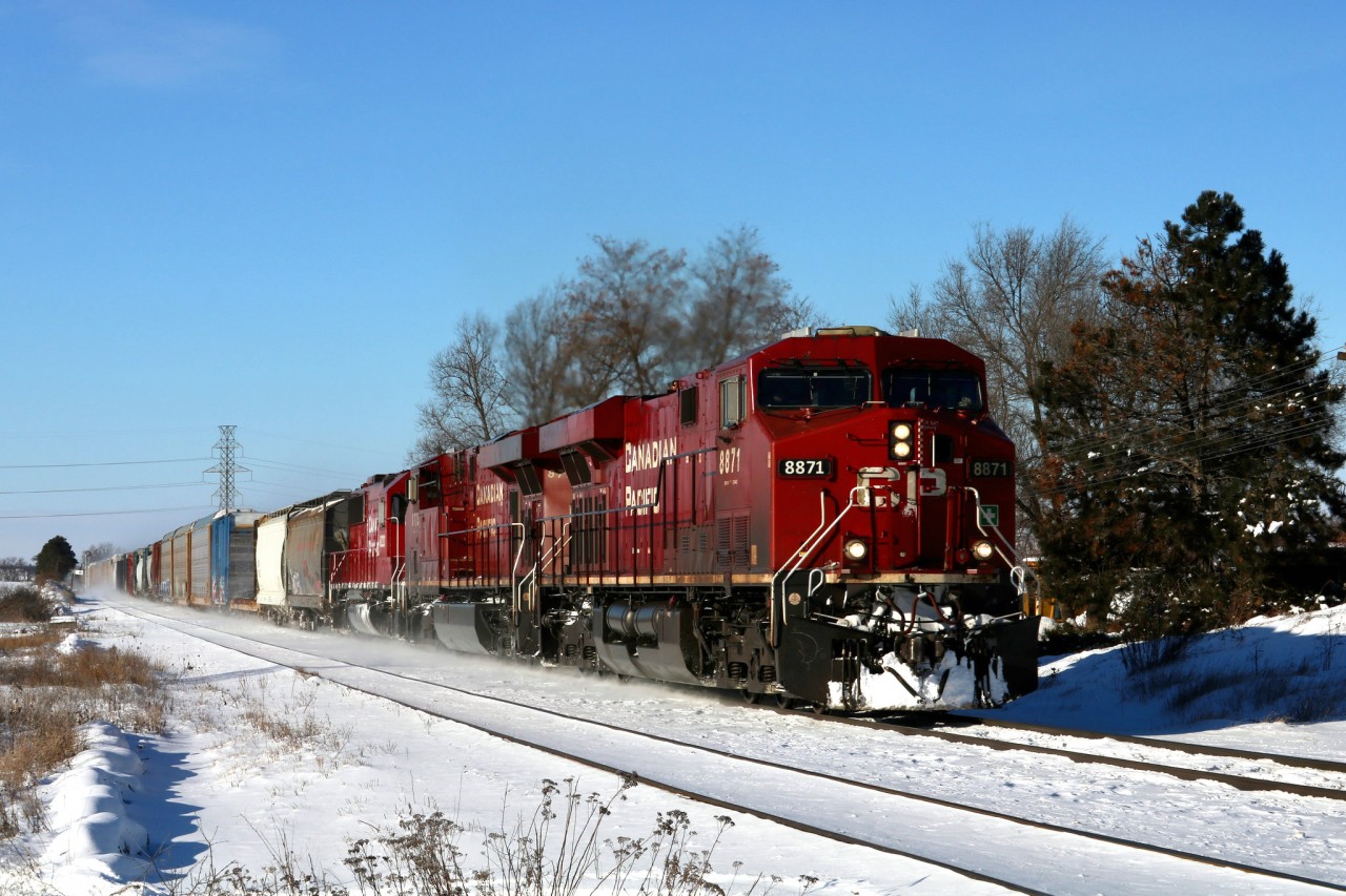 On a cold New Years Day, 234 hustles past Orrs Lake Siding.