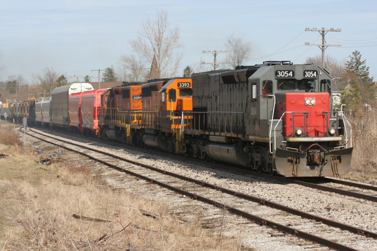 Goderich-Exeter Railway train 431 is seen heading westbound through Baden, Ontario with former Southern Pacific now GEXR SD45-T2 3054, SD40-2 3393 and SD40-2 3394.