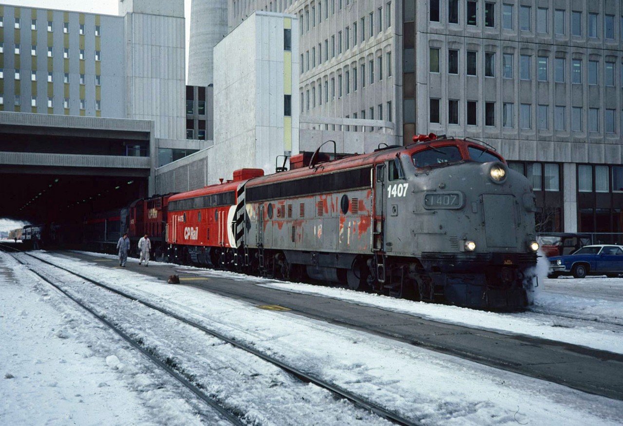 By 1978, CP Rail was less than enthused with passenger service, and VIA was going to inherit it later that year anyhow.  Corporate pride certainly didn't even enter the equation when 1407 was assigned as lead unit on The Canadian.
A shutdown of the Angus paint shop left a few units unpainted, and rather than let them sit, CP put them on the road until space became available at the Ogden paint shop.
1407 was one of them, and she is seen ready to depart Calgary with train 2, the eastbound Canadian, Feb 5, 1978.