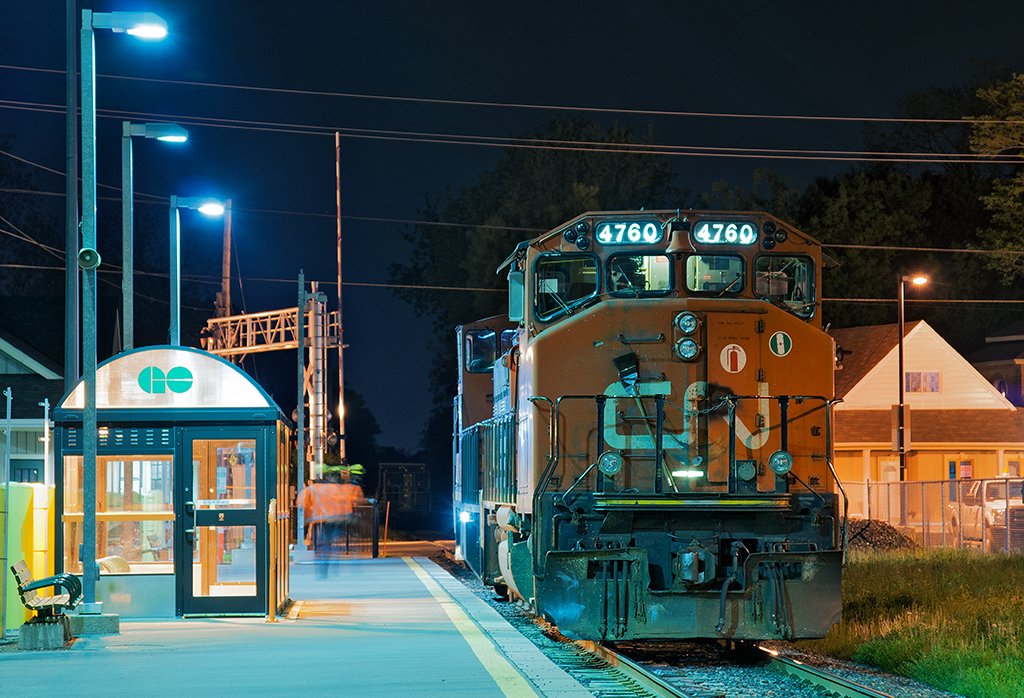Rare move With the train tied down south of the crossing, shop forces from Mac Yard attend to the ailing power parked by the GO station for the night. This is a rare move especially on this part of the Uxbridge Sub as power nor train never goes north of Underwood and never is parked for the night.