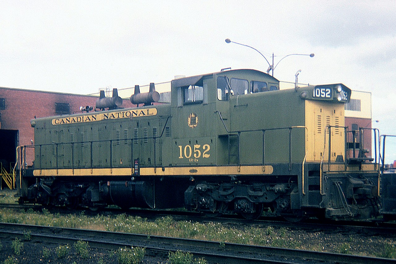 Sitting in CN's sprawling Symington yard many years ago is 1052. Always a treat to catch anything in the green and gold. GMD-1 #1052 was built in 1959, and in 1989 it underwent overhaul and renumbered 1419.
