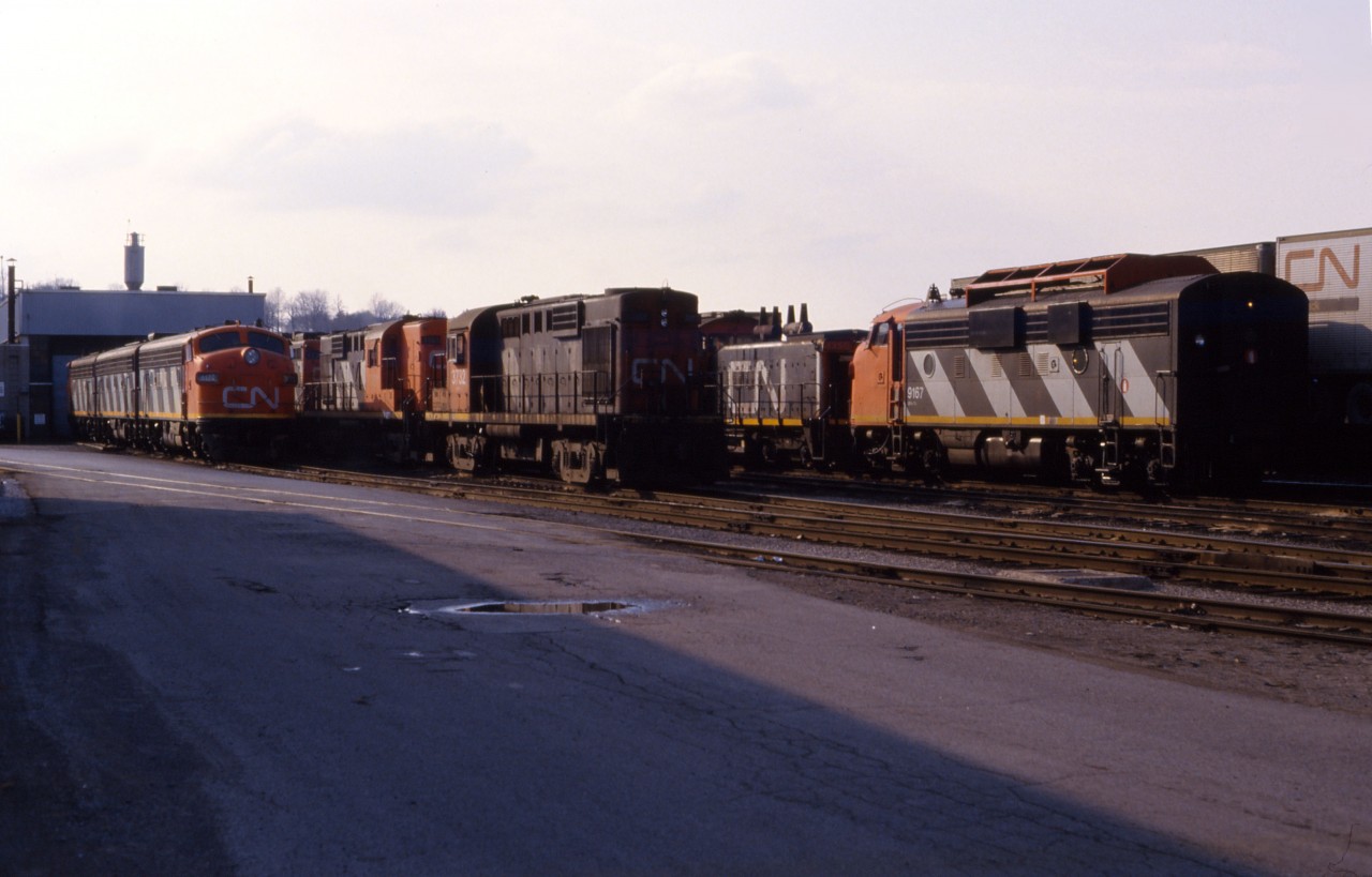 An interesting variety of power idles at the Stuart Street diesel shop in Hamilton. Visible are an A-B-A set of F7s led by the 9172; another F7A (9167); a pair of RS18s (3732 and 3701); a GP9; and SW1200RS 1350. Classic railroading in "the Hammer"!