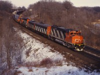 Here's another one of those fascinating 1980s lash-ups--this time a GP40-2LW, F7Bu, F7Au, GP40-2LW and SW1200RS--heading a westbound CN freight through Bayview.