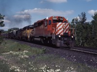 In the mid-1980s, "FPON" was common on CP Rail in the form of Conrail GP38s, as well as B&O/Chessie System GP40s and GP38s (as well as a few Algoma Central SD40-2s). Here we see a westbound approaching Guelph Jct with CP SD40-2 5935, B&O GP40 3724, and CR GP38 7747. It all ended when CP received its GP38-2s in the late 1980s.