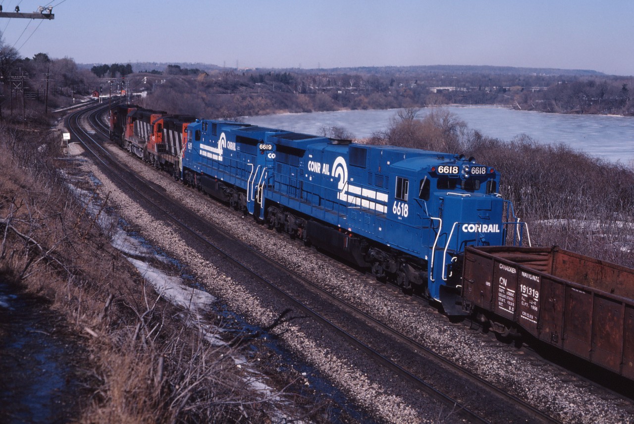 Here we see a pair of Conrail C32-8 units heading for Toronto. These units are probably beginning demonstrations on CN which saw them in use system-wide between March and June 1986,resulting in an eventual order for C40-8M locomotives delivered in 1990. Full consist: CN 9460, 9302, 4565,CR 6619 and 6618.