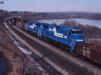 Here we see a pair of Conrail C32-8 units heading for Toronto. These units are probably beginning demonstrations on CN which saw them in use system-wide between March and June 1986,resulting in an eventual order for C40-8M locomotives delivered in 1990. Full consist: CN 9460, 9302, 4565,CR 6619 and 6618.