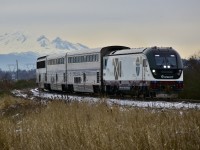 A bleak morning at Colebrook junction as the Amtrak Cascades #510 approaches the signals. Power today is supplied by a recently delivered WSDOT "Charger" unit #1406.