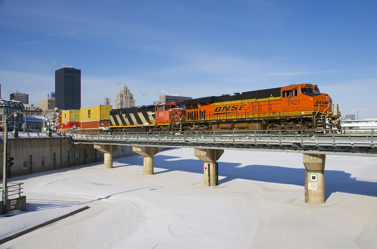 Very unusually for Eastern Canada, a BNSF unit is leading a train, with BNSF 7421 and CN 2423 the power on a late CN 149 leaving the Port of Montreal. This BNSF unit led CN X388 (emtpy windmill flats) from Chicago to Joffre yard near Quebec City and then went back west on a CN 309 which terminated in Taschereau Yard in Montreal this morning. The power then went light to the port to bring a short (336 axles) CN 149 out on a cold but sunny day.