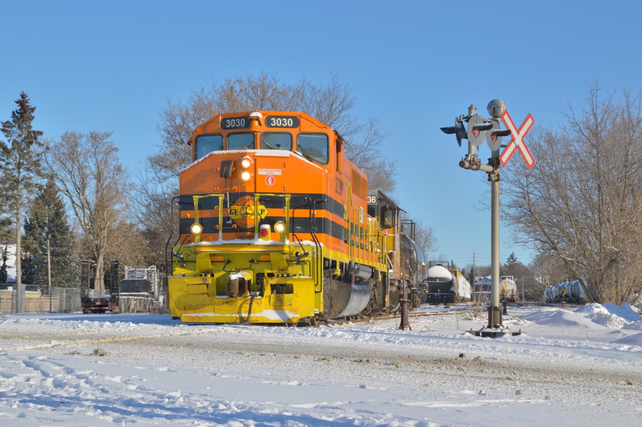 The day has just begun for 582 as tank and centerbeam cars are lifted from XV Yard for the trip to Cambridge.  Just one day earlier this scene looked like spring, but winter hangs on.