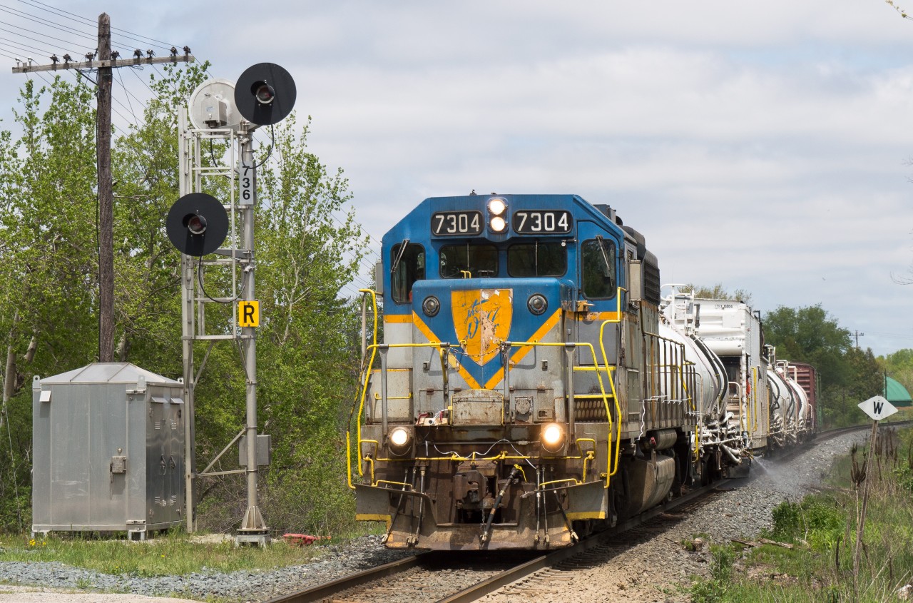 One of two remaining Delaware and Hudson GP38-2's in original paint spent a couple weeks floating around Southern Ontario on the weed spraying train.  Here we see it approaching Drumbo on the Galt Subdivision