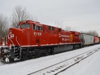 CP 8122 North creeps up the siding at Medonte with train 119 after meeting counterpart 118. CP 8122 is an AC4400CWM formerly CP 9628, and sports the sharp new "Modern Beaver" look on her first trip West after being released from GE in Texas over the last couple weeks. 