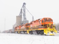 RLHH 595 blasts through Hagersville amid a snow streamer, contrasting nicely against the new paint of RLHH 2111.