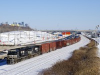 NS 6911 & NS 9151 lead CN 529 on CN's Montreal Sub. Of note is that the westbound lanes of autoroute 20 were on the south side of the tracks until a couple of weeks ago (well, they're still there, but no longer in use). They are now located where the Turcot Yard used to be, out of the sight at left in this photo. The CN tracks here will also disappear during 2018, with CN's main line moving to the left as well. 
