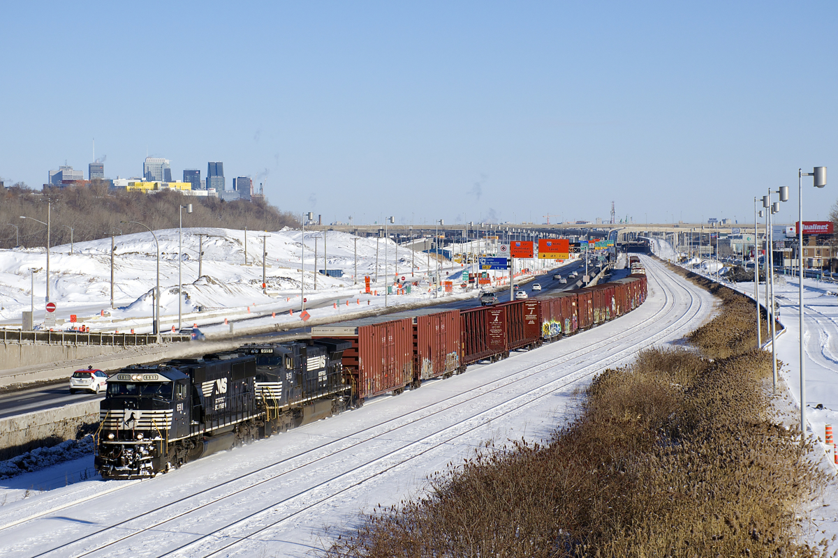 NS 6911 & NS 9151 lead CN 529 on CN's Montreal Sub. Of note is that the westbound lanes of autoroute 20 were on the south side of the tracks until a couple of weeks ago (well, they're still there, but no longer in use). They are now located where the Turcot Yard used to be, out of the sight at left in this photo. The CN tracks here will also disappear during 2018, with CN's main line moving to the left as well.