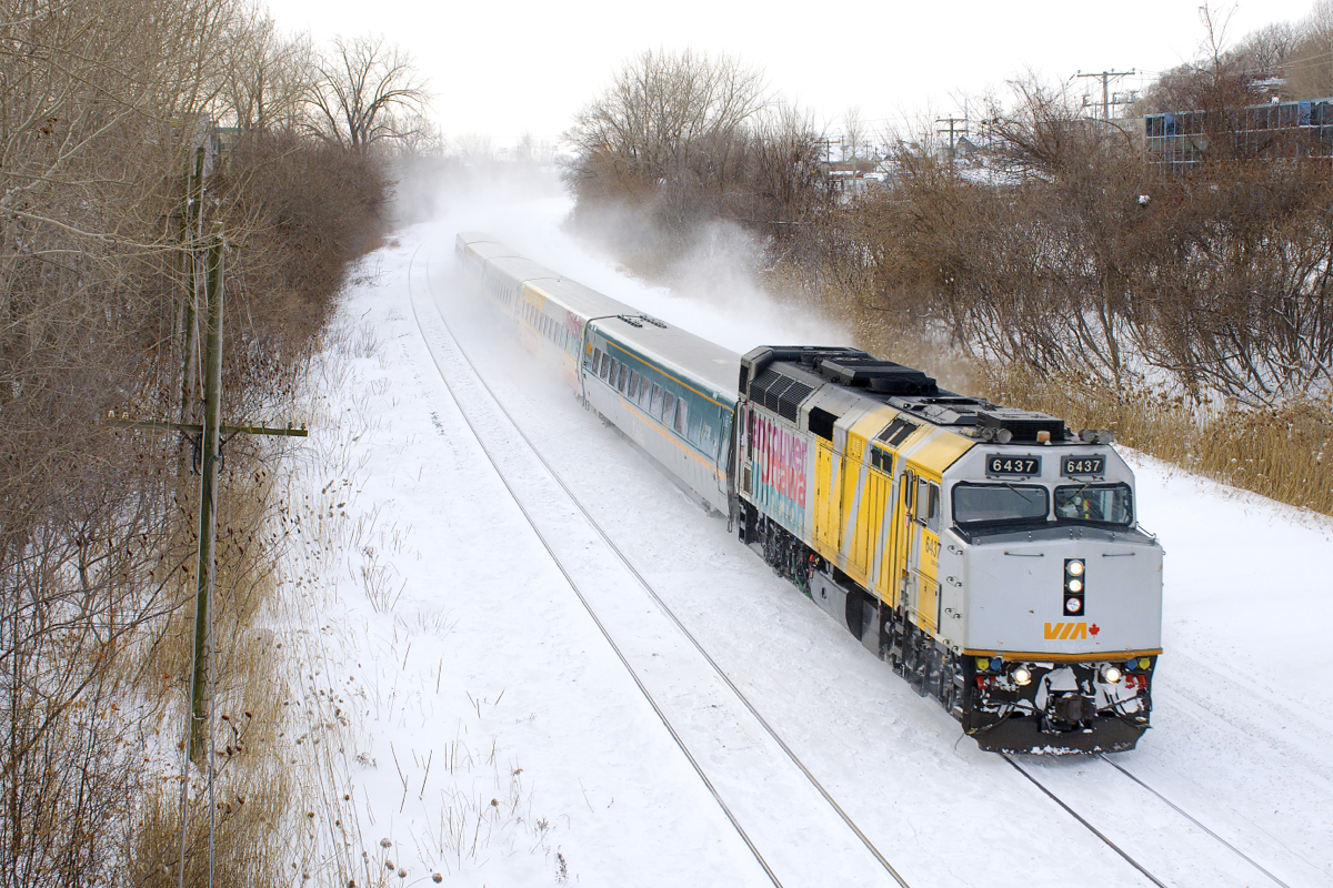 VIA Rail has started to remove 'Canada 150' markings from rolling stock, as has happened with VIA 6437 (one of four F40's to a Canada 150 wrap). It is seen here leading VIA 62, kicking up the snow with five LRC coaches in tow.