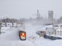 Normally CN 305 would stop with its head end beside the shack at bottom right in this photo to change crews at Turcot West, but here a very late CN 305 blows by it after changing crews at Southwark Yard (most likely because the previous crew ran out of hours). Power is CN 2295 & CN 2531.