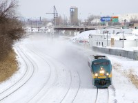 VIA 65 is only about fifteen minutes out of Central Station but is already two and a half hours late as VIA 915 leads five LRC cars through Montreal West.