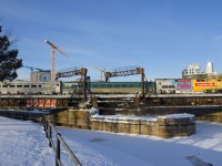 VIA 22 is backing out of Central Station in Montreal with VIA 913 pushing.
