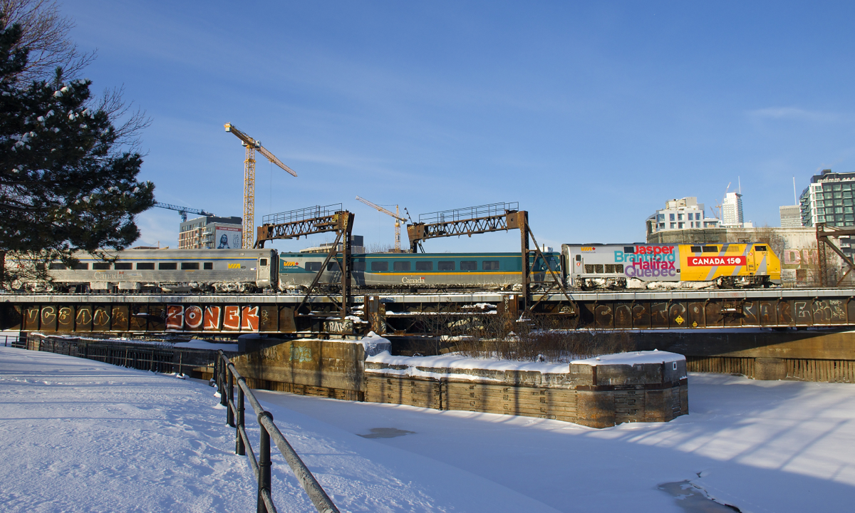 VIA 22 is backing out of Central Station in Montreal with VIA 913 pushing.