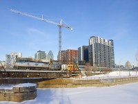 <b>A close call!</b> VIA 33 (shown here backing out, on its way to Ottawa) nearly blocked my shot of AMTK 514, surprisingly the power on the southbound <i>Adirondack</i> today. It is seen here deadheading to Central Station, with part of Montreal's skyline in the background.