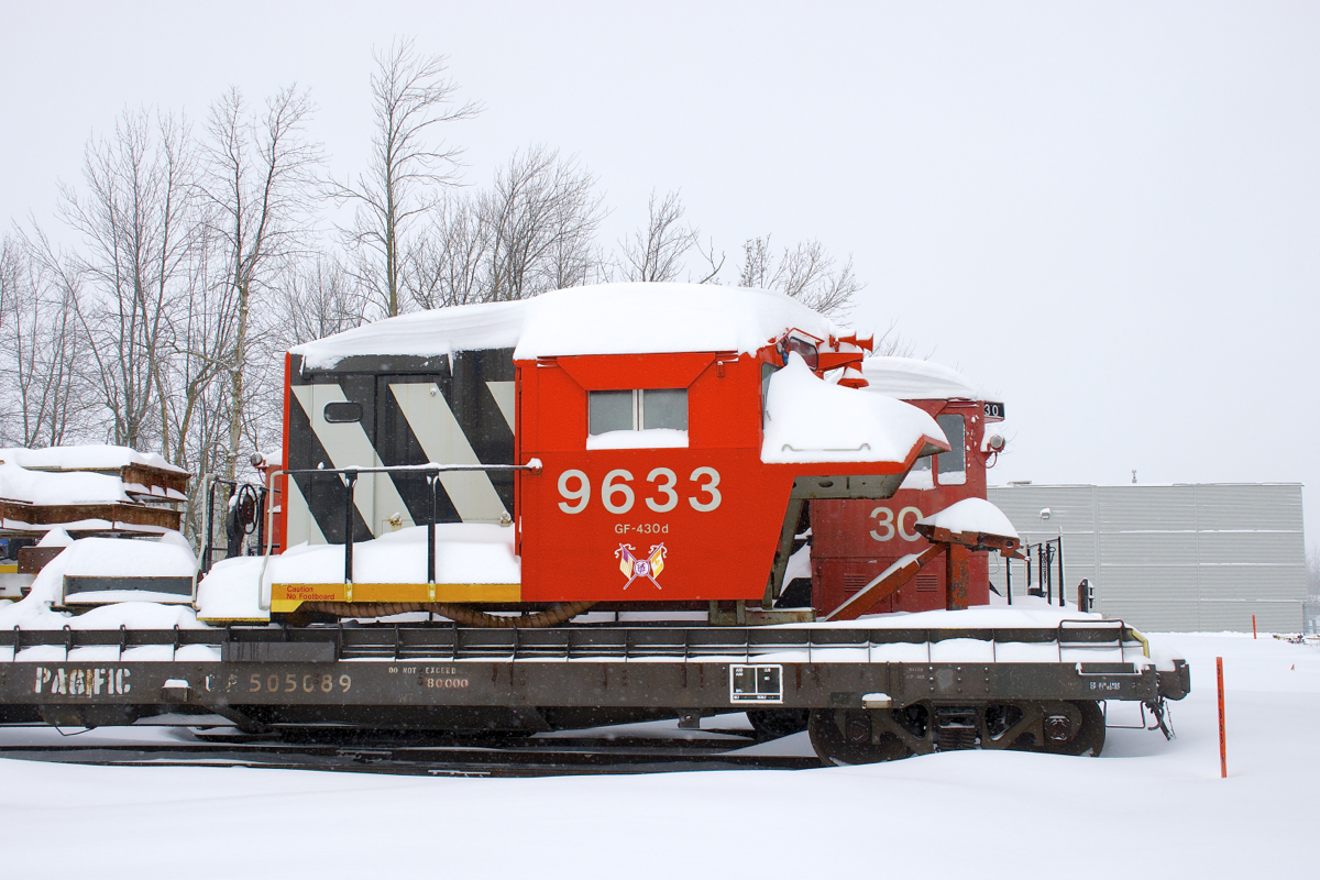 For sale at one point (in 2013), locomotive simulator 'CN 9633' is still on the property at Exporail, its current dispostion unknown. Here it is seen covered in snow after a snowfall of 36 centimetres (14 inches) had just ended in the Montreal area. Behind it is 70-tonner CN 30.