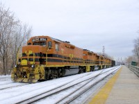 <b>Another G&W detour move in Montreal.</b> A few months after sister G&W company QGRY had to detour into Montreal on CN's main line (due to a derailment on their bridge between Terrebonne and Laval), now the SLR is having to detour into Montreal due to a bridge being washed out at Bromptonville, Qc, with SLR detouring over CMQ and then CP. Here SLR 394 is passing through Lasalle Station on CP's Adirondack Sub with a long and heavy train. Power is SLR 804, SLR 3804, SLR 3008 & QGRY 3102.
