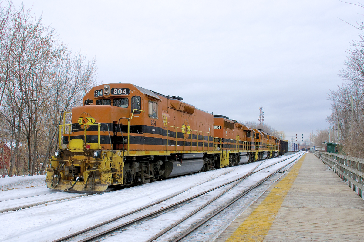 Another G&W detour move in Montreal. A few months after sister G&W company QGRY had to detour into Montreal on CN's main line (due to a derailment on their bridge between Terrebonne and Laval), now the SLR is having to detour into Montreal due to a bridge being washed out at Bromptonville, Qc, with SLR detouring over CMQ and then CP. Here SLR 394 is passing through Lasalle Station on CP's Adirondack Sub with a long and heavy train. Power is SLR 804, SLR 3804, SLR 3008 & QGRY 3102.