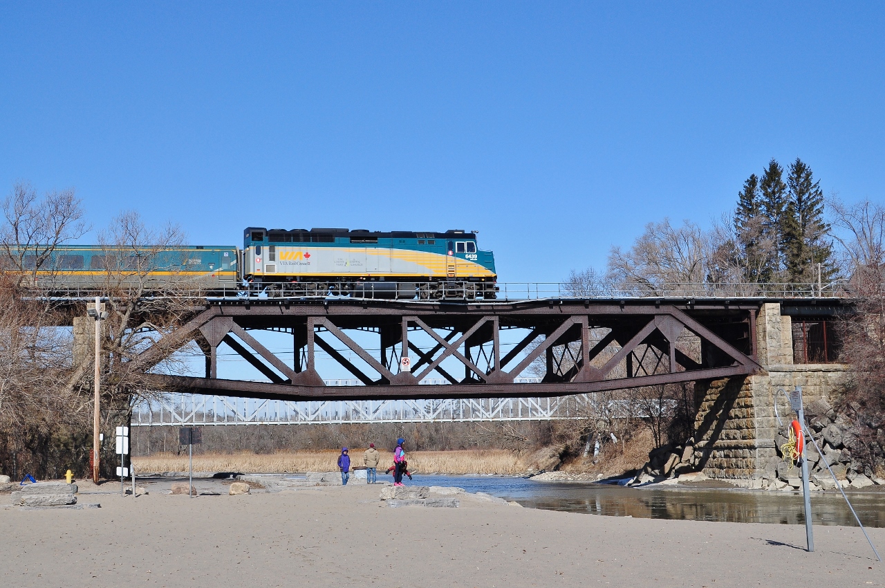 Get your Scarborough Kingston Subdivision pics soon..



...this will all change with Metrolinx adding a third track (south side) Guildwood east to Pickering....including a re-build of the Highland Creek and Rouge River bridges...


Another ubiquitous F40PH power LRC coach train rumbles across the near century old Rouge River bridge.


March 22, 2015 digital by S.Danko at the Rouge River.