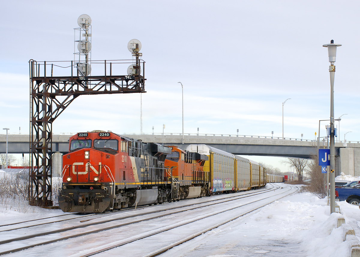 A very rare daylight CN 271 is through Dorval with CN 2240 and BNSF 4275 for power and 85 autoracks for Ingersoll and Windsor.