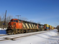 CN 2407 & CN 8813 lead a shorter than usual CN 149 (368 axles) around a curve just past MP 22 of CN's Kingston Sub on a sunny morning.