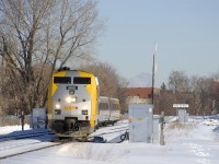 VIA 65 is crossing over from the north track to the south track of CN's Montreal Sub with VIA 905 leading four LRC cars.
