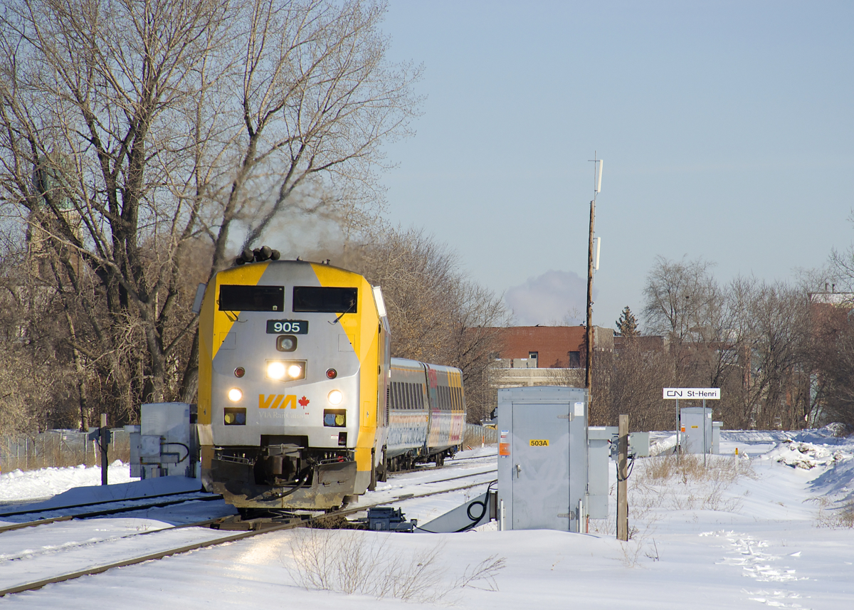 VIA 65 is crossing over from the north track to the south track of CN's Montreal Sub with VIA 905 leading four LRC cars.