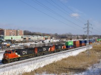 CN 149 is about to pass MP 14 of the Kingston Sub with a trio of SD75I’s (CN 5732, CN 5742 & CN 5673) & 193 platforms.