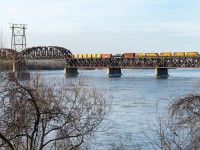 Detour SLR 394 is crossing over the St. Lawrence River on CP's Adirondack Sub, nearly onto the island of Montreal. Power is SLR 3004, QGRY 3102, SLR 3008, SLR 3804 & SLR 804.