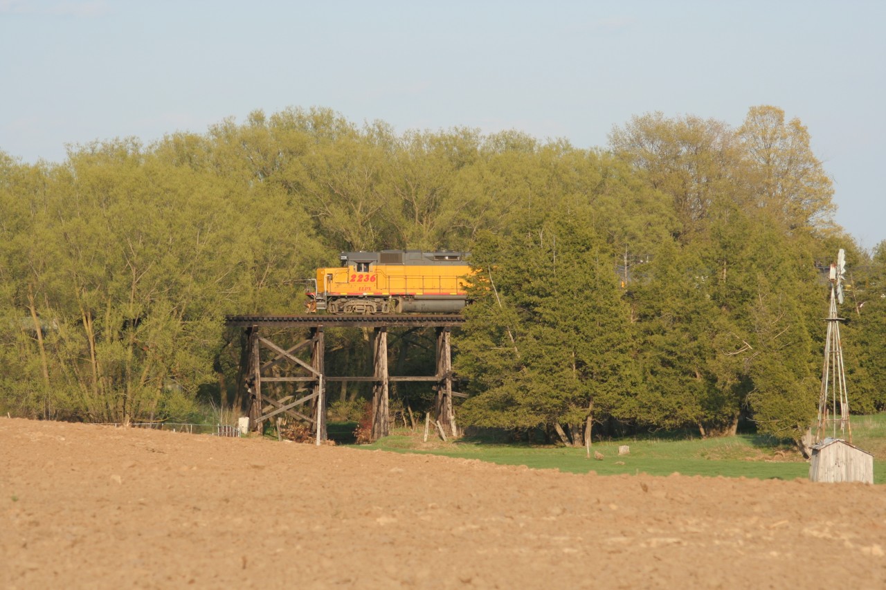 GEXR train 584 with LLPX GP38-2 2236 is crossing over the Martin Creek wooden trestle between Waterloo and St. Jacobs, Ontario has it leads five tankers to Elmira on the Waterloo Spur.