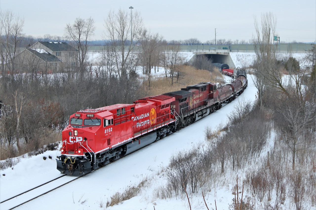 What a contrast in colour between the freshly refurbished CP 8102 and its running mate in CP 8575 as CP 246 heads out from under the Highway 6 overpass at Newman Road.