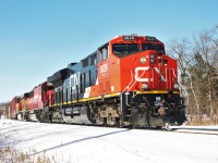  After getting a good soaker from falling through the snow covered ice, I was able to snap this shot of CP T-28 returning from a morning of interchange work with NS in Oakwood Yard in Detroit, MI. T-28 had a nice colourful lashup sporting paint from 3 of the 7 North American Class 1 railroads; CN, CP, and BNSF. In this picture, they are shoving their train into Windsor Yard. Windsor is a pretty inefficient area for CP as evident by a quick look on a maps website. The city is set up for ferry service and the tunnel was only really meant to be used by trains on the now defunct CASO Sub. Road trains that have work to do in Windsor Yard must make a cut at Dougall Ave, pull up to Lakeshore Jct (McDougall Ave), then shove on the original main into the yard. The same steps have to be done only in reverse on their way out of th e yard after finishing their work. Hopefully they'll figure something out in the near future to make Windsor a more efficient area on their network.